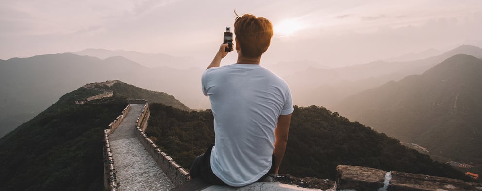 foreigner taking picture on top of great wall of china