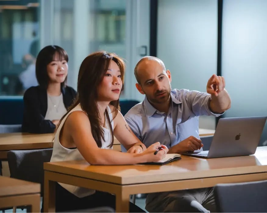 img-staff-members-pointing-things-out